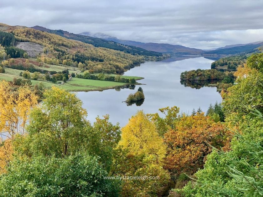 Scottish loch in autumn surrounded by gold and green trees Scotland Highlands aesthetic